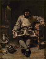 Courbet, Gustave - Marc Trapadoux betrachtet ein Buch mit Kunstdrucken