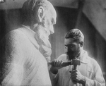 Anonymous - Russian sculptor Sergey Merkurov (1881-1952) working on his statue of Leo Tolstoy