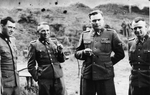 Anonymous - SS officers socialize on the grounds of the SS retreat Solahuette outside of Auschwitz. Left: Dr. Josef Mengele