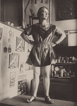 Rodchenko, Alexander Mikhailovich - Evgenia Sokolova (Zhemchuzhnaya) presents a sports suit designed by Varvara Stepanova