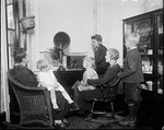 Photo studio Harris & Ewing - American Family group listening to radio