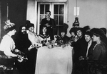 Anonymous - Rasputin (second from left) at the meal among His Admirers