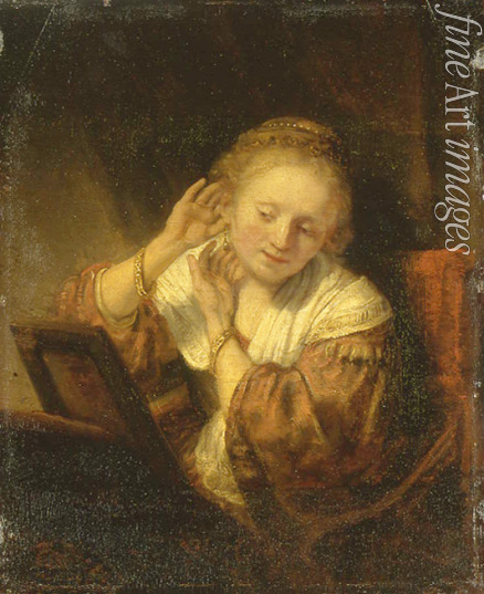 Rembrandt van Rhijn - Junge Frau, die Ohrringe anprobiert